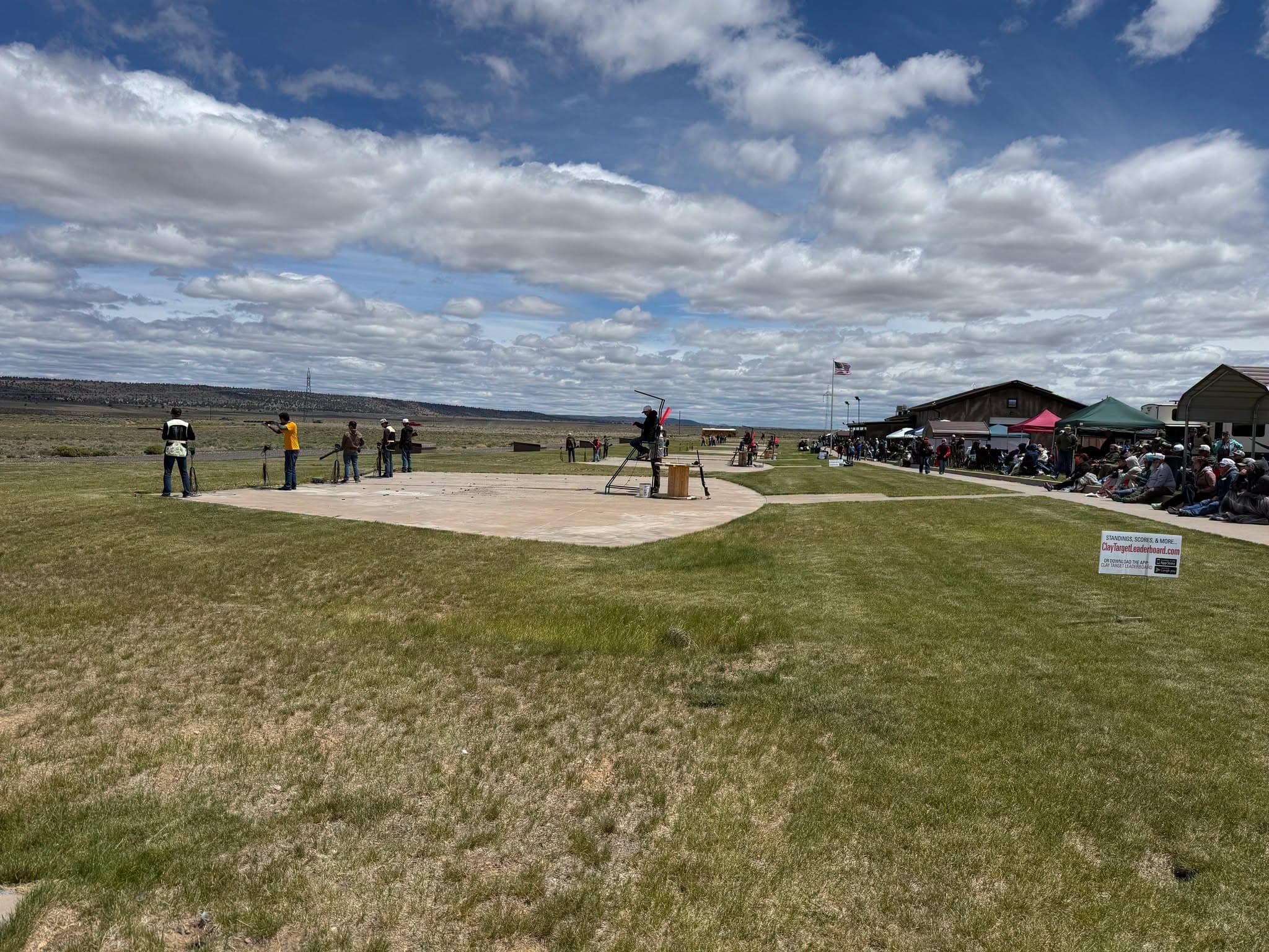 A squad shooting under big high desert clouds at Bend
