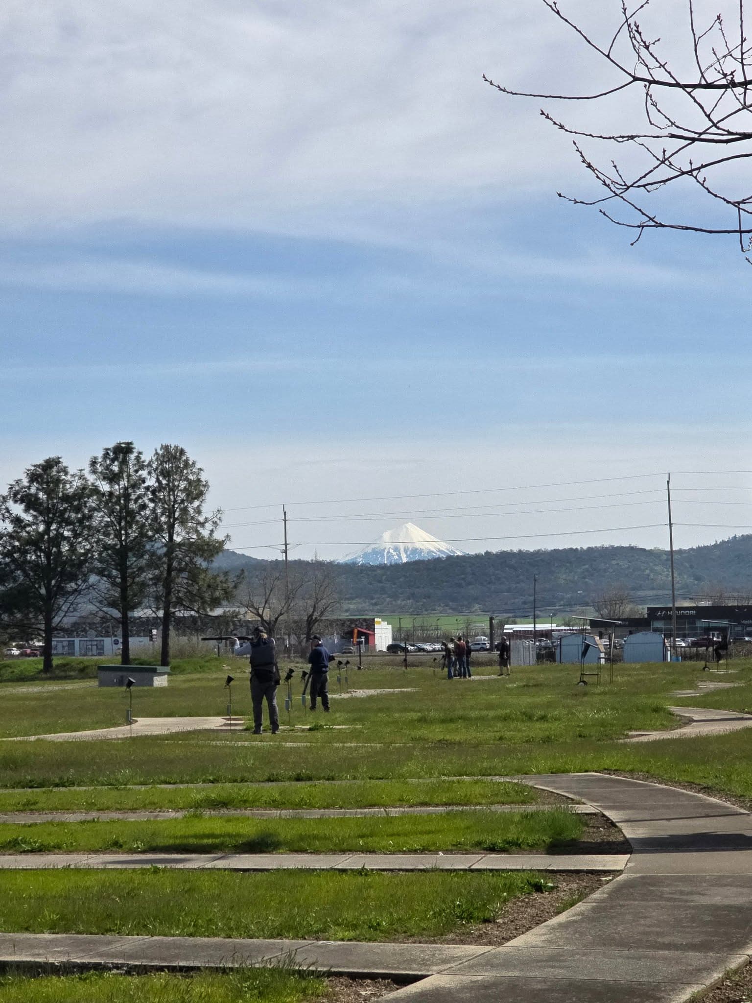 Trap fields with snow-capped mountains on the horizon at Medford